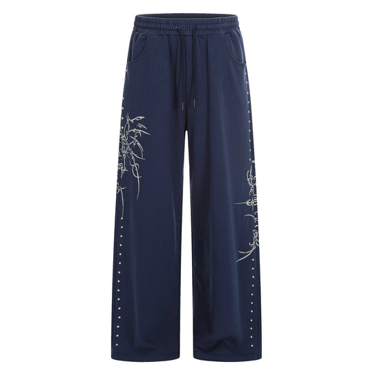 Damen Weite Sweatpants mit Tunnelzug, Ziernieten und grafischem Print Shop Nory