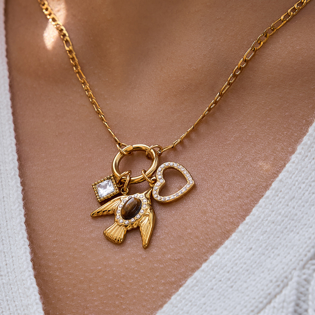 Damen Halskette mit einzigartigem Vogelanhänger und funkelnden Zirkonia-Details Shop Nory