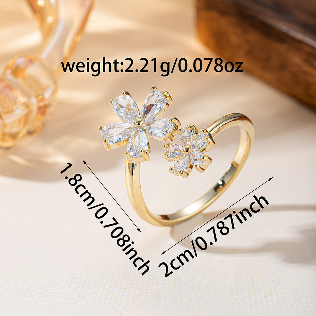 Damenring mit filigranem Blumenmuster und funkelnden Zirkonia Shop Nory