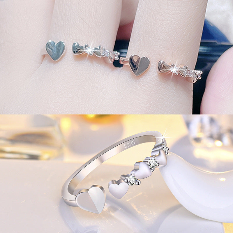 Damenring mit dekorativen Herzmotiven und funkelnden Zirkonia Shop Nory