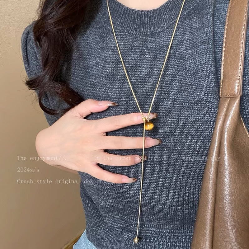 Damen Halskette mit einem einzigartigen Tigeraugen-Anhänger und glänzendem Gold-Design Shop Nory