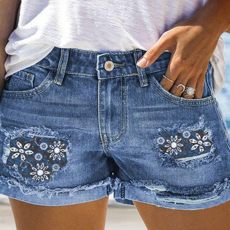Damen Modische Destroyed Denim-Shorts mit floralem Design