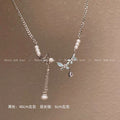 Damen Halskette mit kunstvollem Schmetterlingsanhänger und eleganten Perlendetails Shop Nory