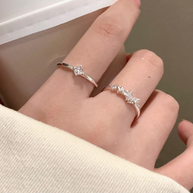 Damen eleganter Ring mit funkelnden Zirkonia und offenem Design Shop Nory