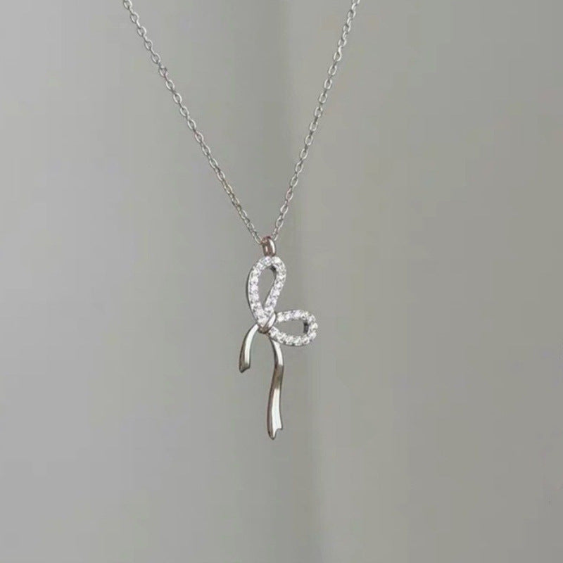 Damen Halskette mit elegantem Schleifenanhänger Shop Nory