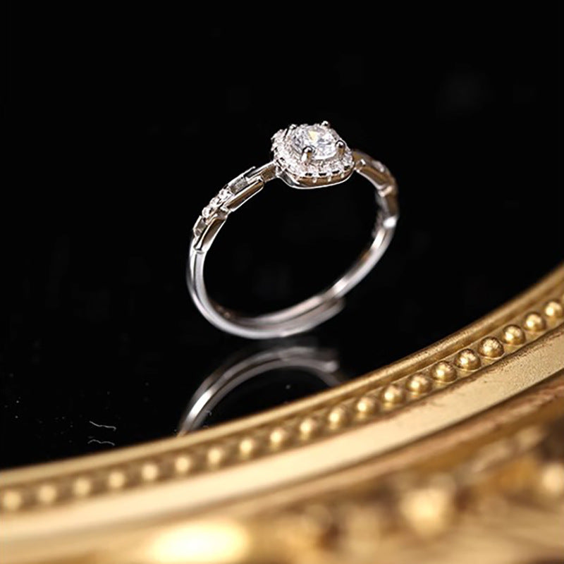 Damen Eleganter Verlobungsring mit funkelndem Zirkonia und filigraner Fassung Shop Nory