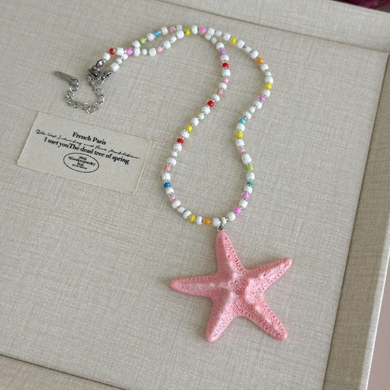 Damen Kette mit einzigartigem Sternenanhänger und buntem Perlenmuster Shop Nory