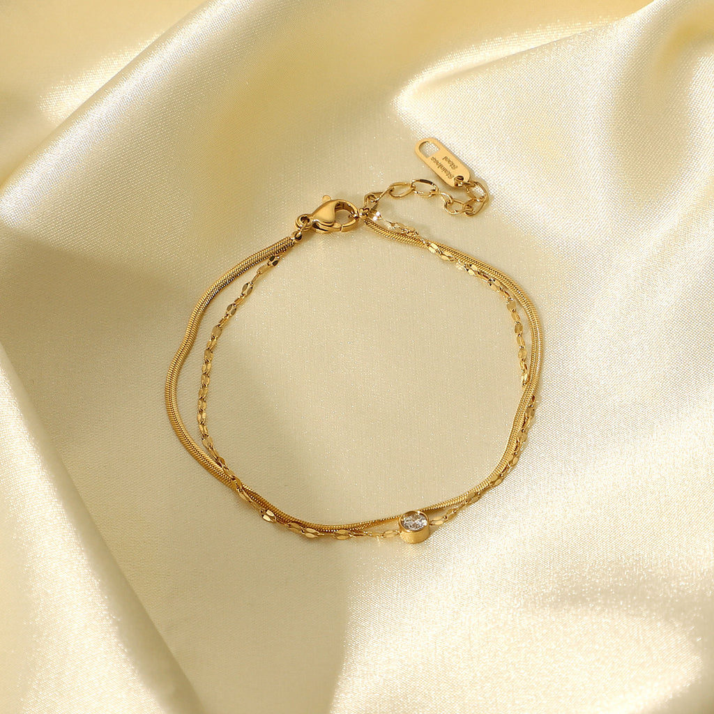 Damen Armband mit feinem Kettendesign und eleganten Zirkonsteinen Shop Nory