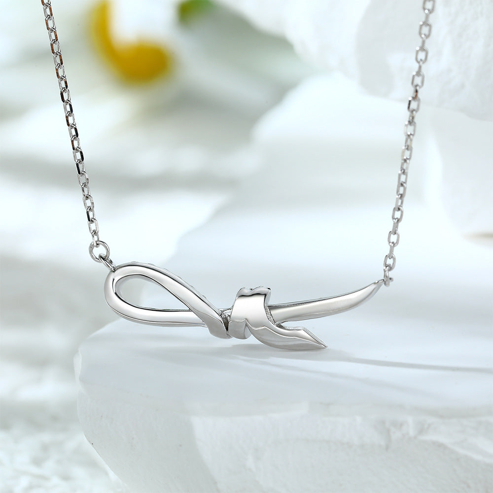 Damen Halskette mit elegantem Schleifenmotiv und funkelnden Zirkonia-Steinen Shop Nory