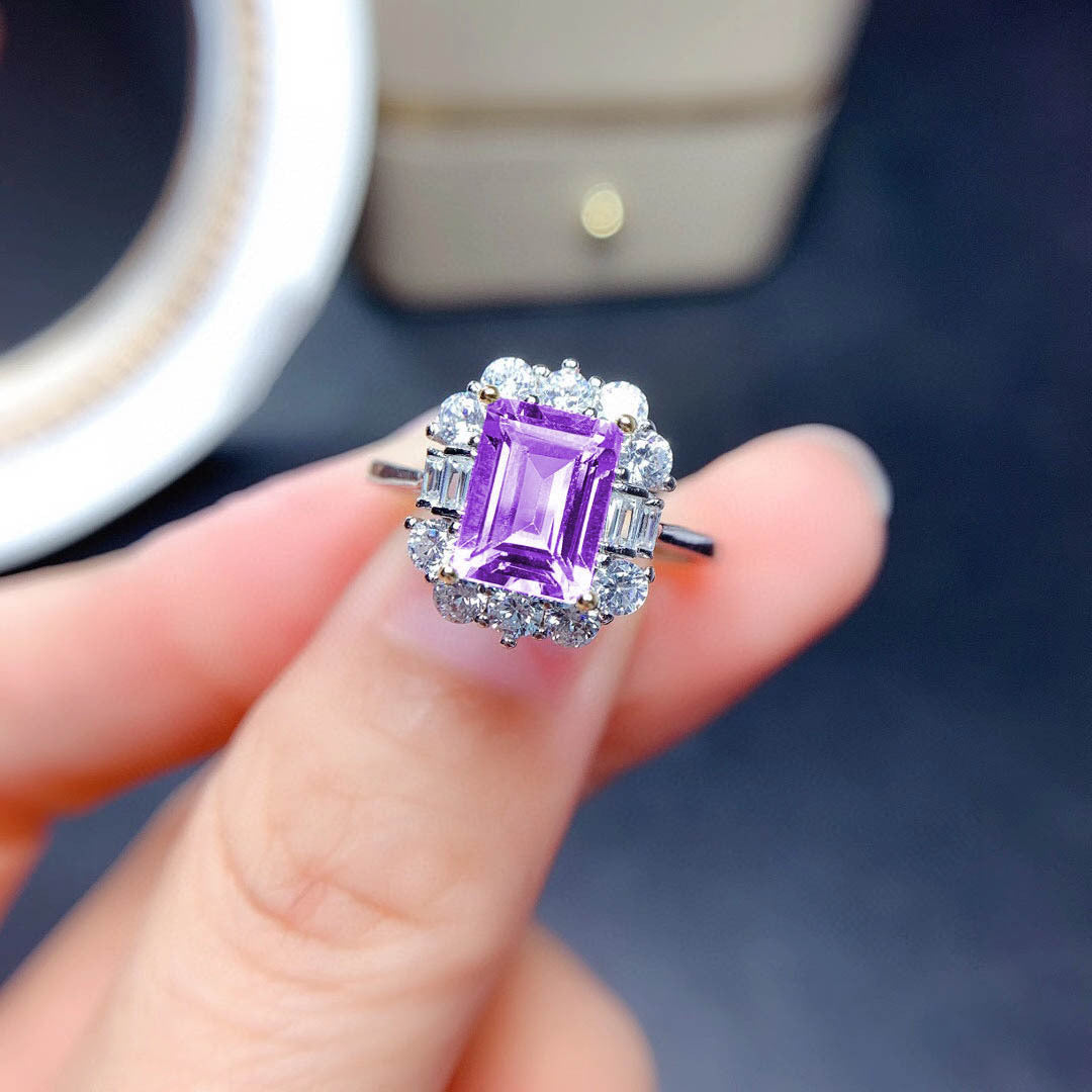 Damenring mit luxuriösem rechteckigen Edelstein und funkelnden Zirkonia Steinen Shop Nory