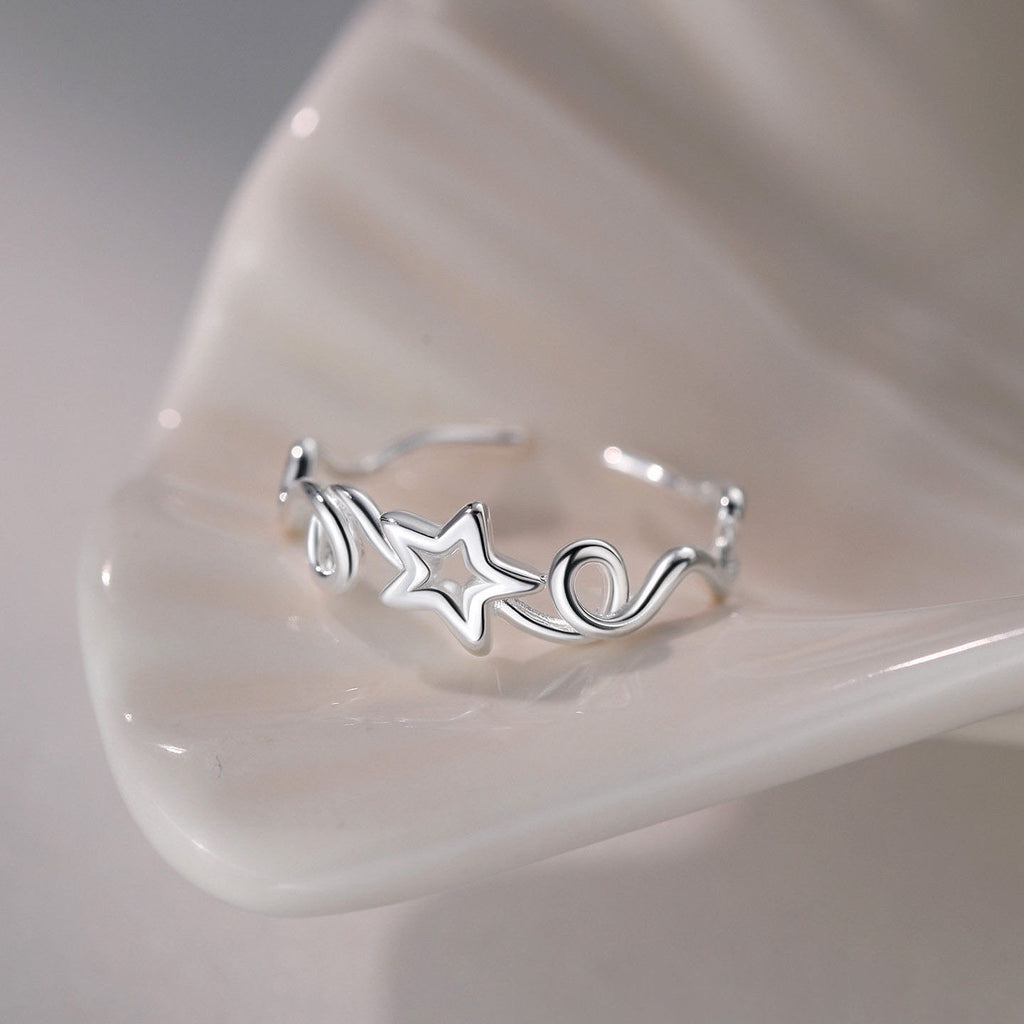 Damen eleganter geschwungener Ring mit Sternenmotiven Shop Nory