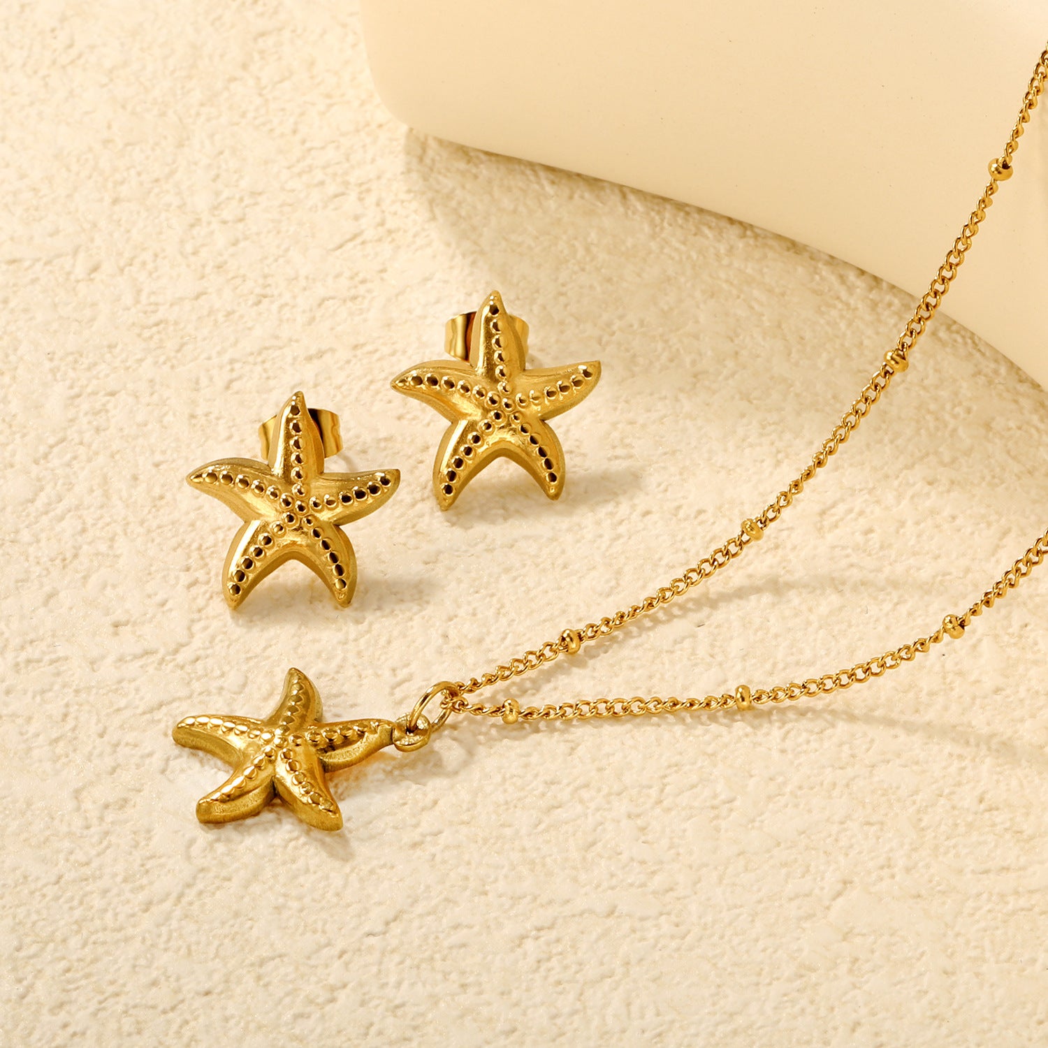 Damen Schmuckset mit glänzendem Sternenanhänger und passenden Ohrsteckern Shop Nory