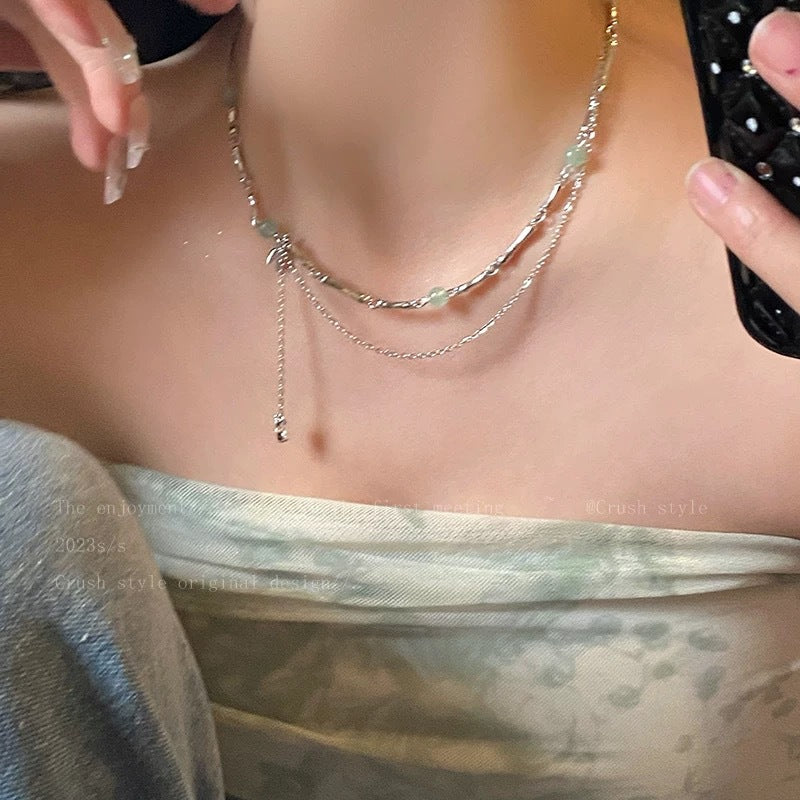 Damen Halskette mit filigranen Gliederketten und eleganten Edelsteinanhängern Shop Nory