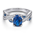 Damenring mit elegantem, geschwungenem Design und funkelnden Zirkoniasteinen Shop Nory