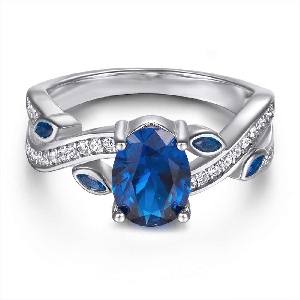 Damenring mit elegantem, geschwungenem Design und funkelnden Zirkoniasteinen Shop Nory