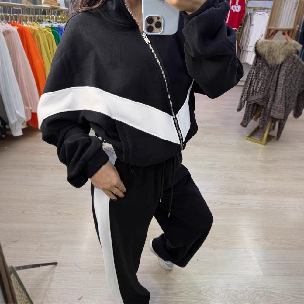 Damen eleganter sportlicher Zweiteiler Trainingsanzug mit Reißverschluss und kontrastierender V-Passe Shop Nory