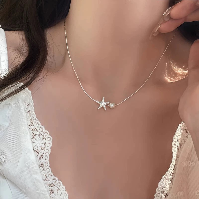 Damen Kette mit verspieltem Seestern-Anhänger und eleganter Perle Shop Nory