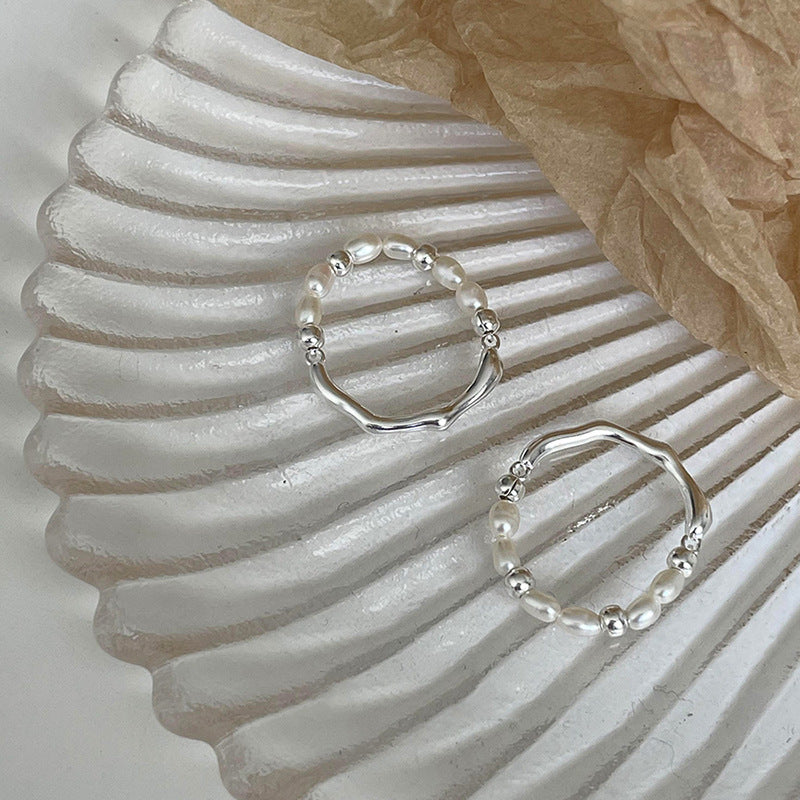 Damen eleganter Ring mit Perlen und geschwungenem Design Shop Nory