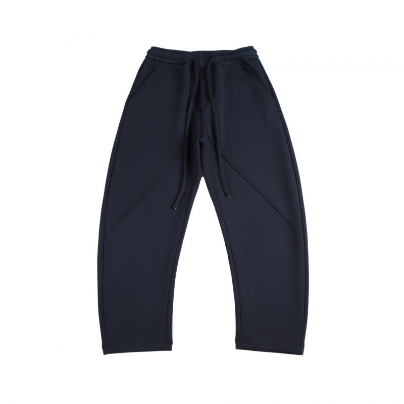 Unisex Weite Tech-Jogginghose mit diagonalem Nahtdesign, Elastikbund und Tunnelzug Shop Nory