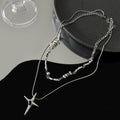 Damen Halskette mit modernem dreidimensionalem Anhänger und eleganten Kettendetails Shop Nory
