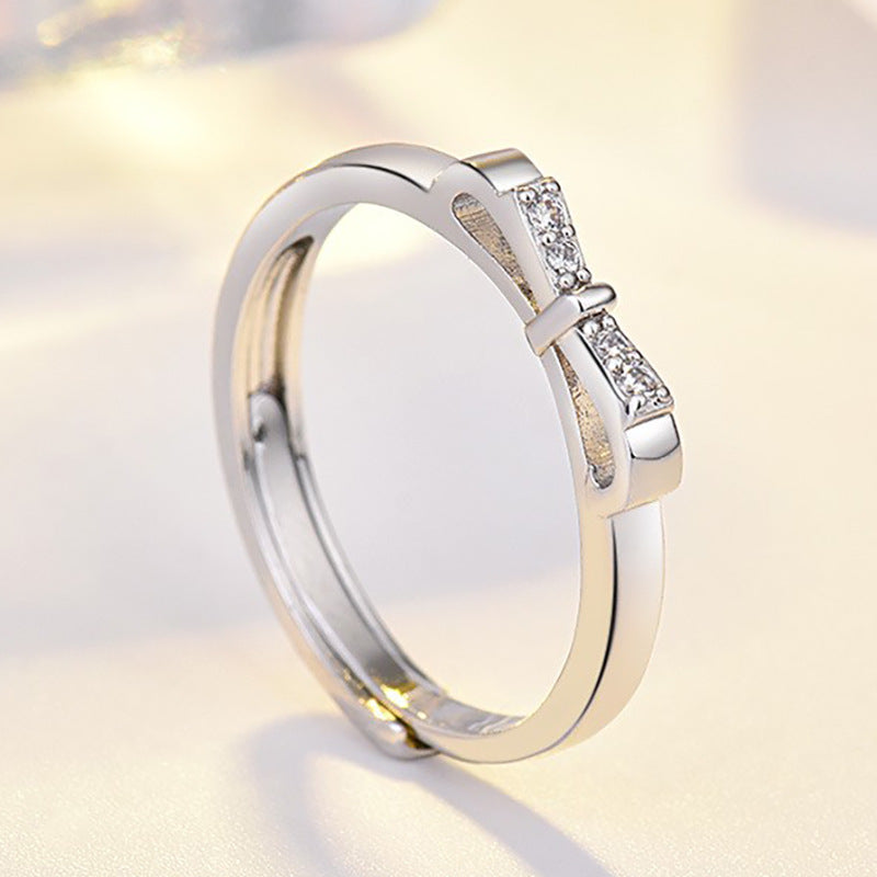 Damenring mit kunstvollem Schleifenmotiv und funkelnden Zirkonia-Details Shop Nory