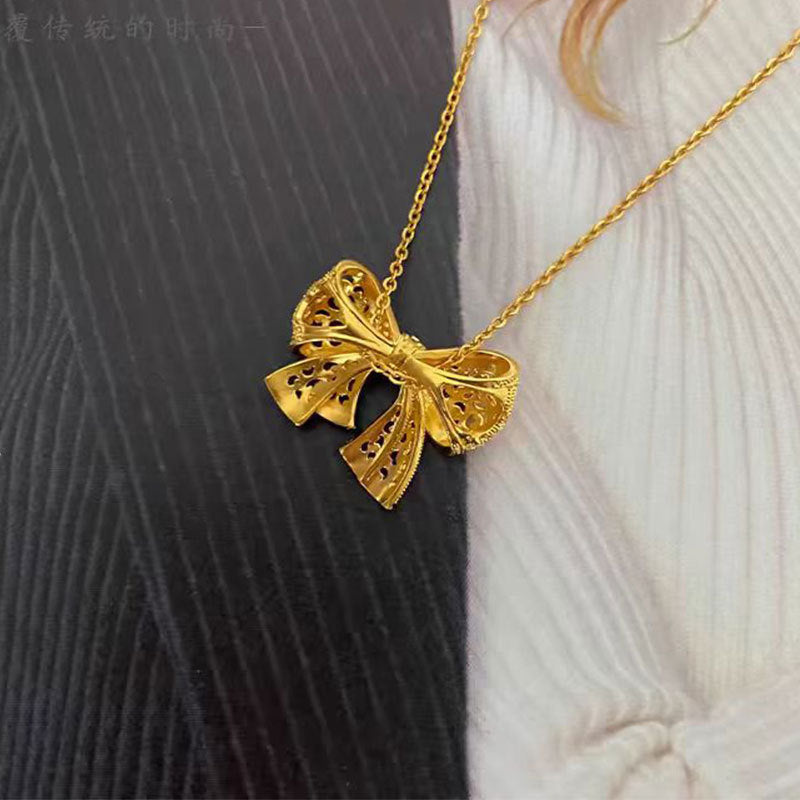 Damen Halskette mit kunstvollem Schleifenanhänger Shop Nory