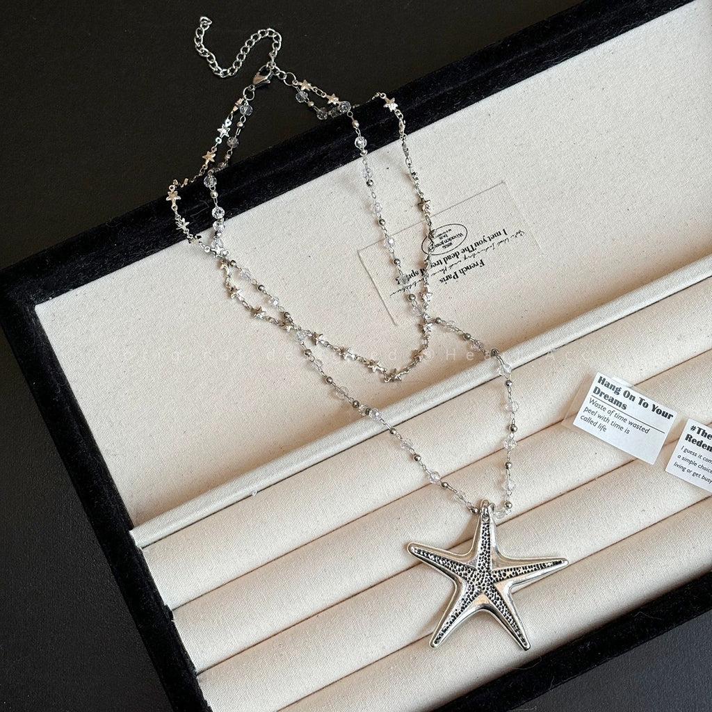 Damen Kette mit schimmerndem Seesternanhänger und exquisiten Perlendetails Shop Nory