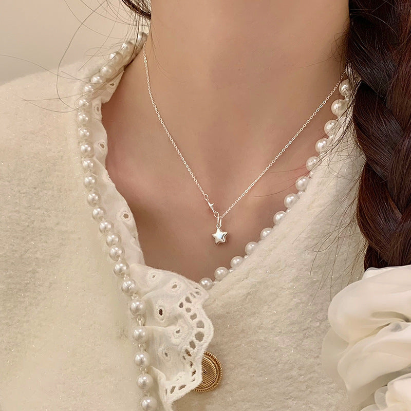 Damen Halskette mit funkelndem Sternanhänger und elegante Verbindungsdetails Shop Nory