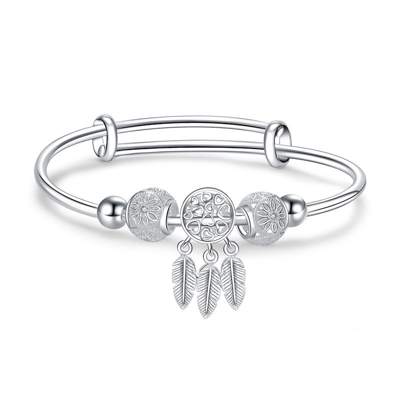 Damenarmband mit kunstvollen Perlen und zarten Federmotiven Shop Nory