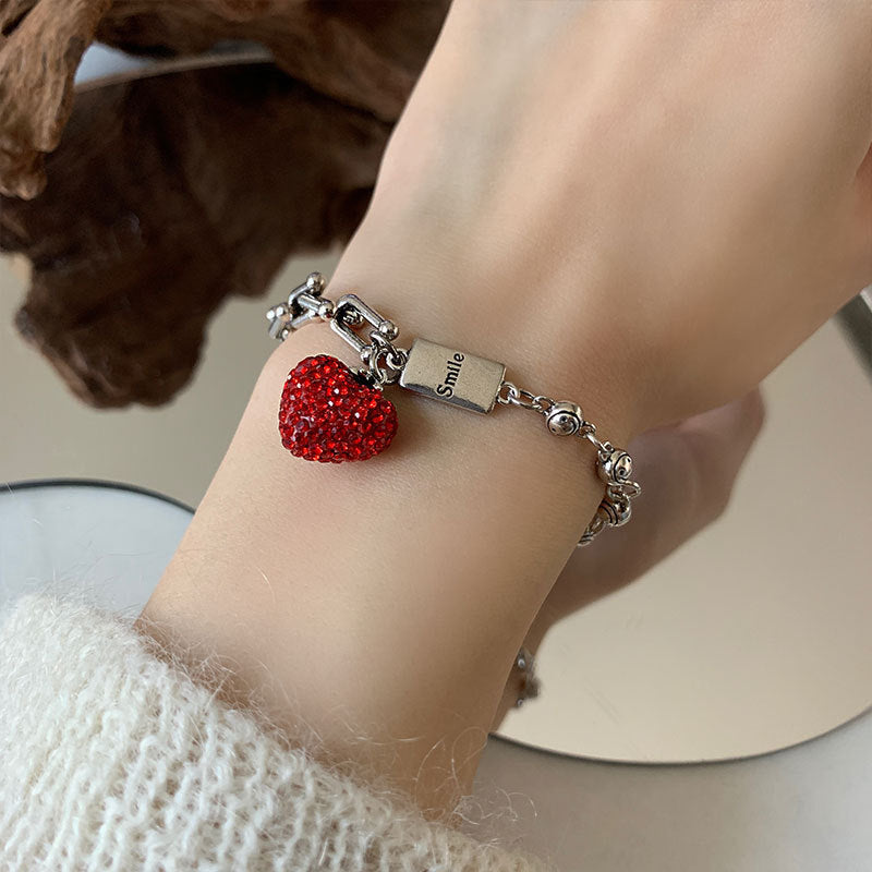 Damenarmband mit herzförmigem Anhänger und funkelnden Details Shop Nory