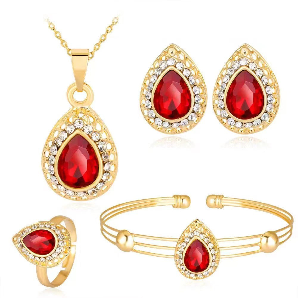 Tropfenförmiges Kristall-Schmuckset mit vergoldeter Halskette, Armband, Ring und Ohrsteckern