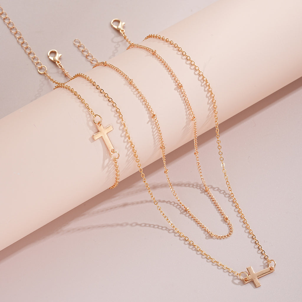 Damen mehrlagige Halskette und Armband-Set mit minimalistischen Kreuzanhängern Shop Nory