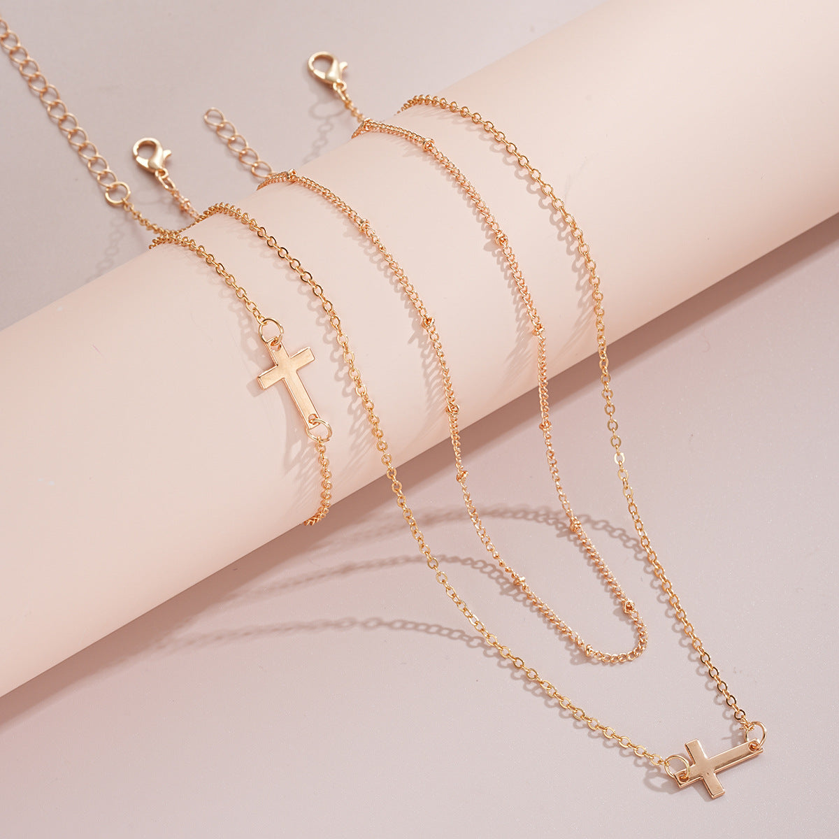 Damen mehrlagige Halskette und Armband-Set mit minimalistischen Kreuzanhängern Shop Nory