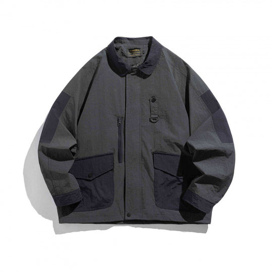 Unisex Oversize Utility-Fieldjacke mit aufgesetzten Taschen, Kontrastpaneelen und versteckter Reißverschlussleiste Shop Nory