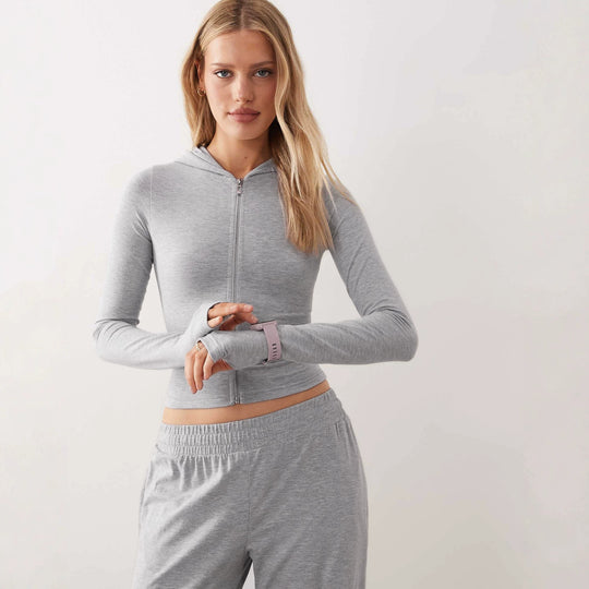 Damen Zweiteiliges Loungewear-Set geripptes Crop-Kapuzenoberteil mit Reißverschluss und Daumenloch sowie weiter Jogginghose Shop Nory
