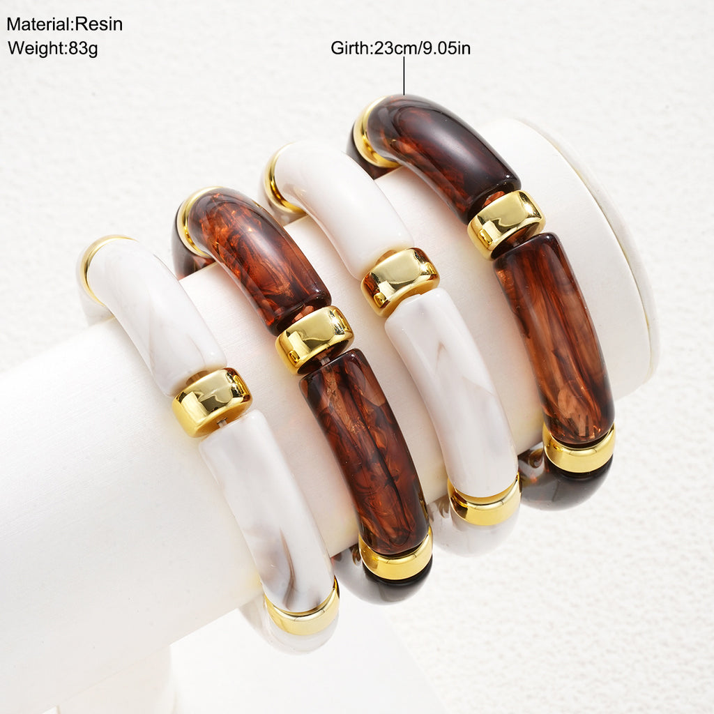 Damen Armreif-Set mit luxuriösen Acrylelementen und goldenen Akzenten Shop Nory