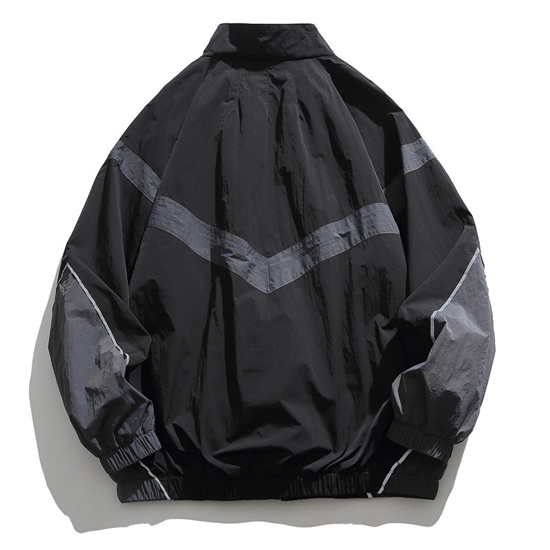 [Unisex] Oversize technische Wind- und Regenjacke mit Stehkragen, reflektierenden Paspeln und elastischem Saum Shop Nory