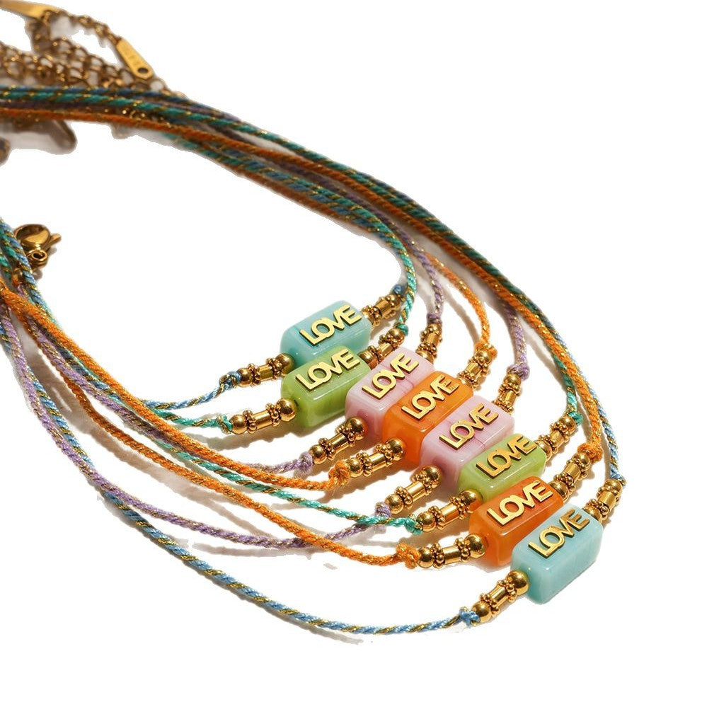 Damen Armband mit liebevollem LOVE-Anhänger und hypoallergenem Edelstahl Shop Nory