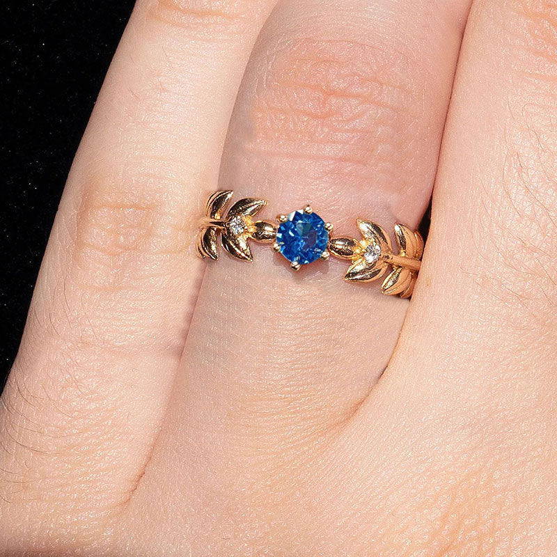 Damen Eleganter Verlobungsring mit blauem Stein und Blattdesign Shop Nory