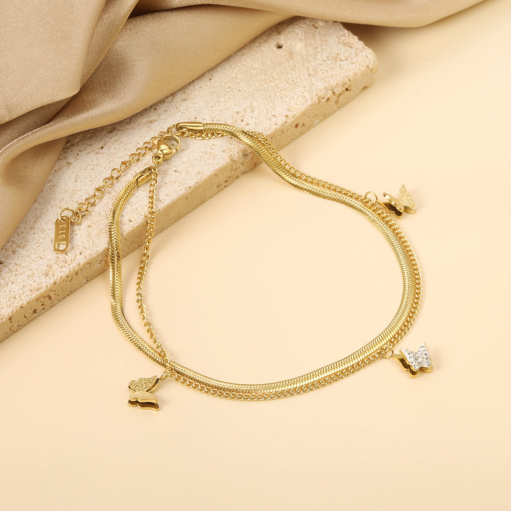 Damen Armband mit zarten Schmetterlingsanhängern und goldplattierter Oberfläche Shop Nory