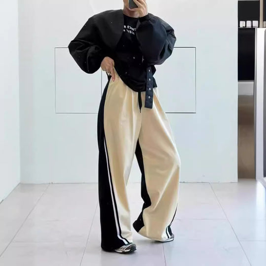 Herren Weite Trackpants mit kontrastierenden Seitenbahnen, hohem Bund und markantem Seitenstreifen Shop Nory