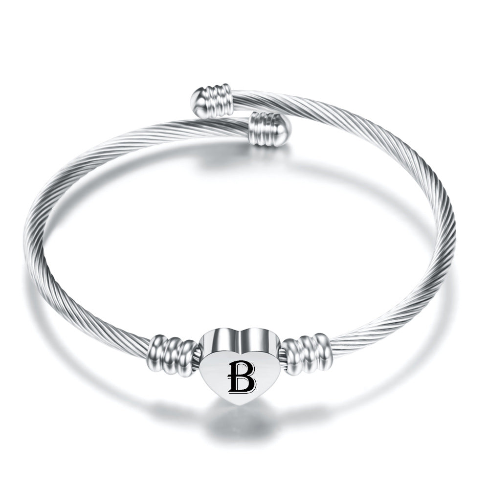 Damen Armreif mit herzförmigem Anhänger und eleganten Akzenten Shop Nory