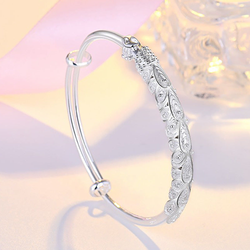 Damen Elegantes Armreif mit kunstvollem Federmotiv Shop Nory