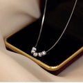 Damen Kette mit kunstvollen Anhängern Shop Nory