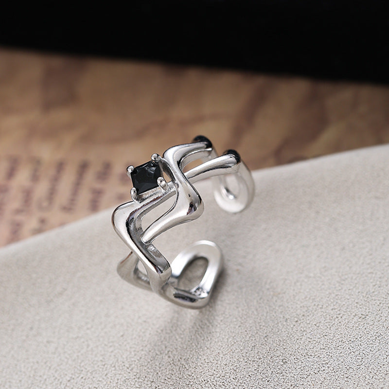 Damen Offener Ring mit künstlerisch geschwungenem Design und zentralem Stein Shop Nory