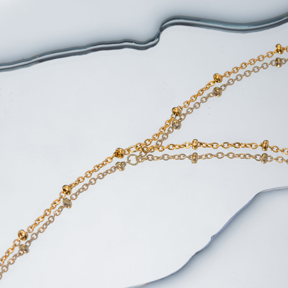 Damen Fußkettchen mit eleganten Zirkonia-Details und feinem Edelstahl-Design Shop Nory
