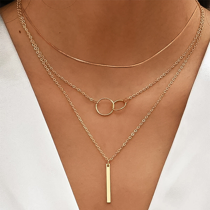 Damen mehrlagige Halskette mit runden Anhängern und elegantem Stangenakzent Shop Nory