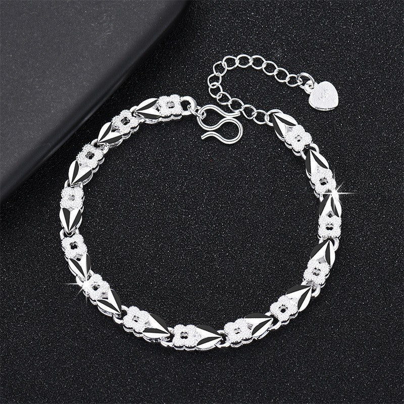 Damenarmband mit filigranem Blumendesign und elegantem Zirkonia-Besatz Shop Nory