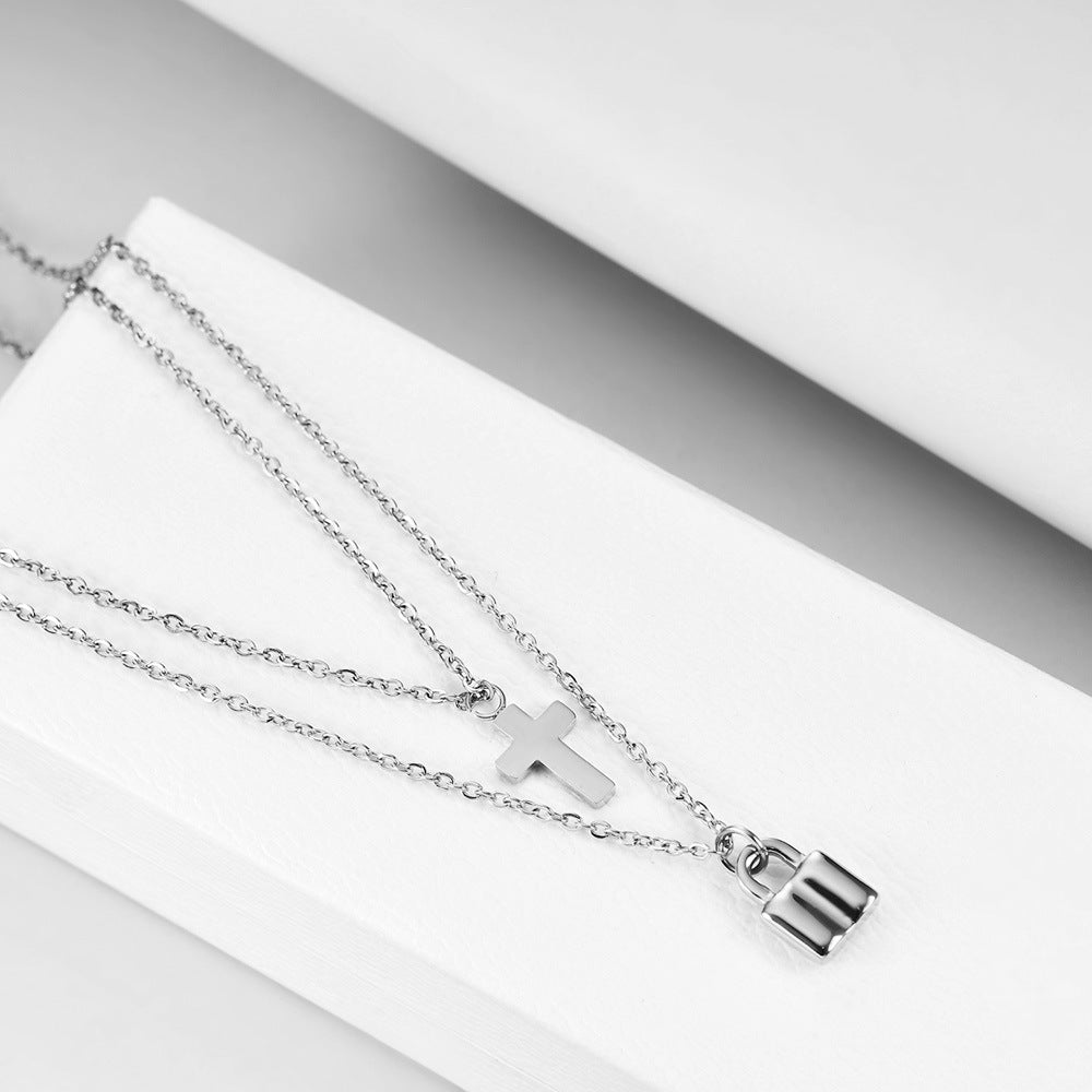 Damen Halskette mit doppeltem Anhänger in Form eines Kreuzes und eines Schlosses Shop Nory