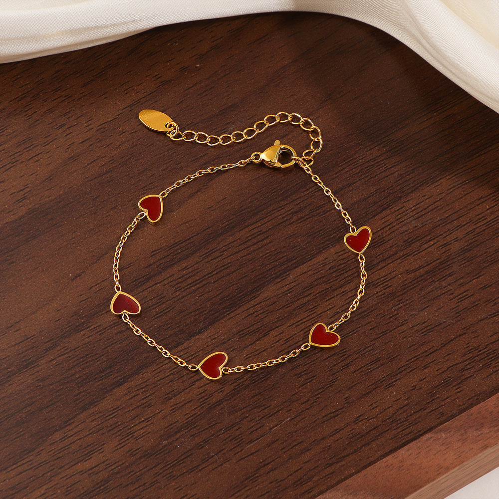 Damen Armband mit herzförmigen Anhängern Shop Nory